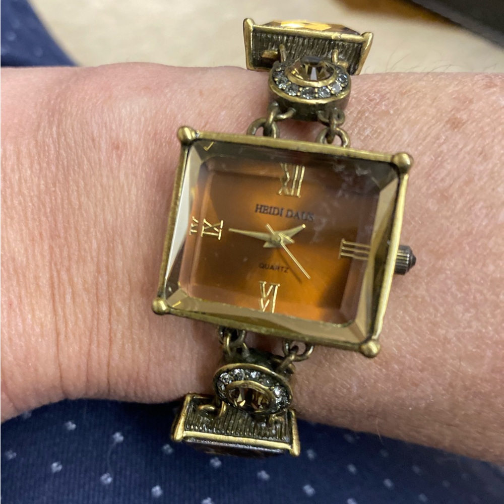 Heidi Daus- watch with amber glass. This watch needs a battery. Has extension.